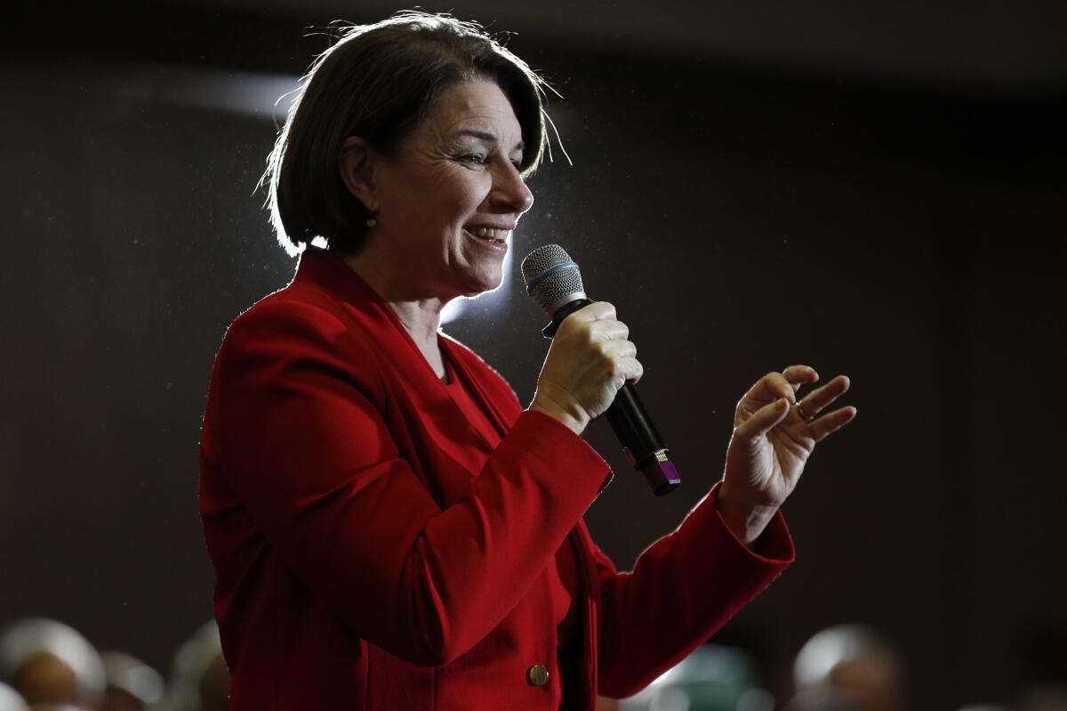 Sen. Amy Klobuchar speaks into a microphone.