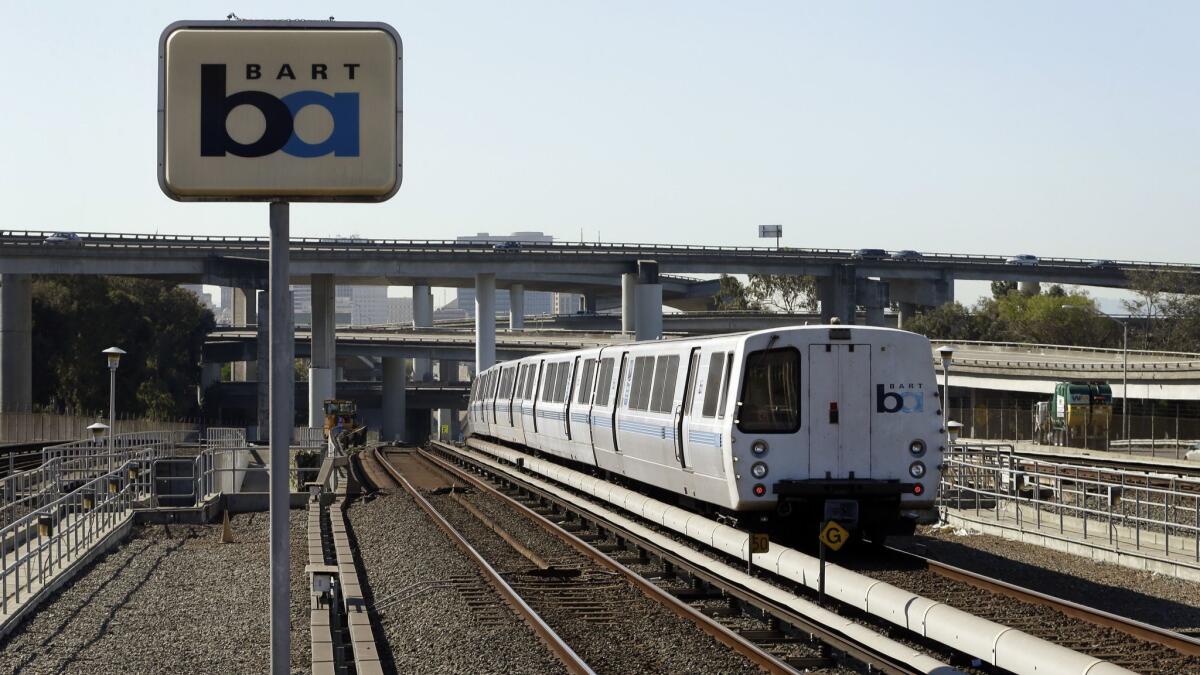 A Bay Area Rapid Transit train leaves the station in Oakland in this 2013 file photo. Regulators fined the agency $650,000 for safety failures that led to a train fatally striking two workers inspecting a track five years ago during a union strike.