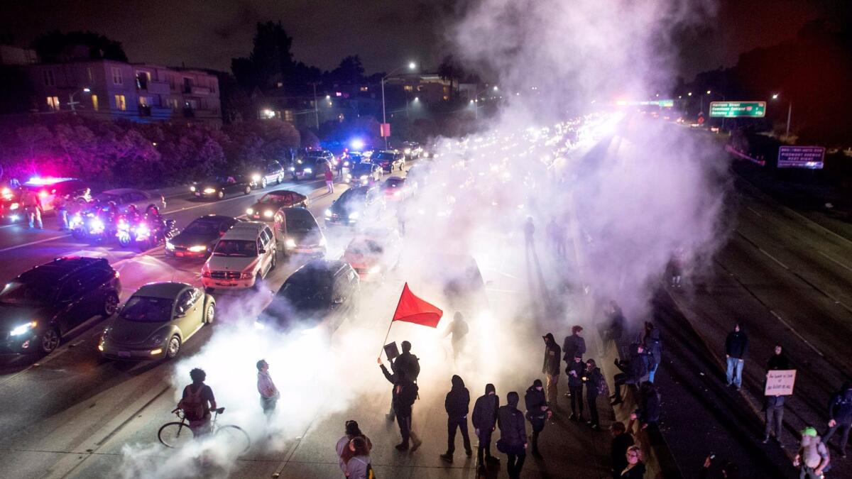 Protesters block both directions of the 580 Freeway during a rally against racism Saturday night in Oakland.