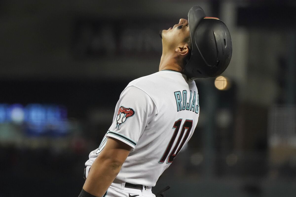 Arizona Diamondbacks' Josh Rojas reacts after striking out against the Colorado Rockies during the first inning of a baseball game Friday, Oct 1, 2021, in Phoenix. (AP Photo/Darryl Webb)