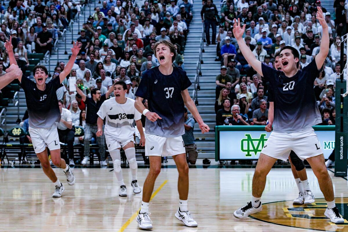 The celebration is on after Loyola defeats No. 1 Mira Costa 3-1 in a boys' volleyball match that attracted 2,500 fans.