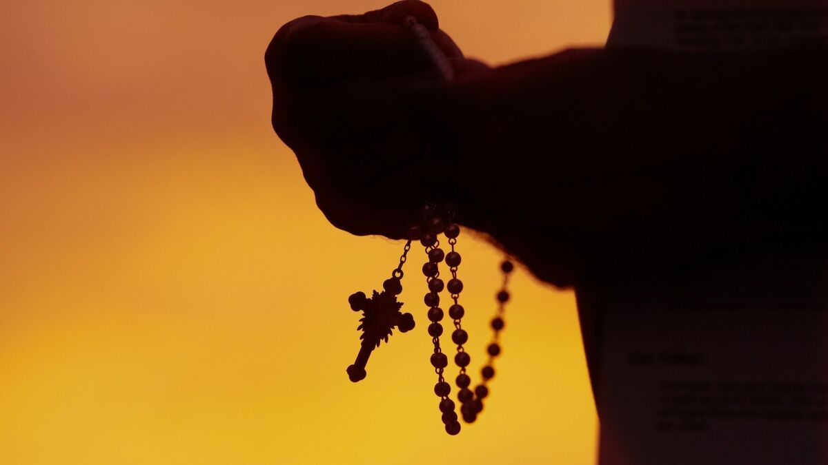 Before one of San Diego Bishop Robert McElroy's "listening sessions," a group gathered to pray the rosary.