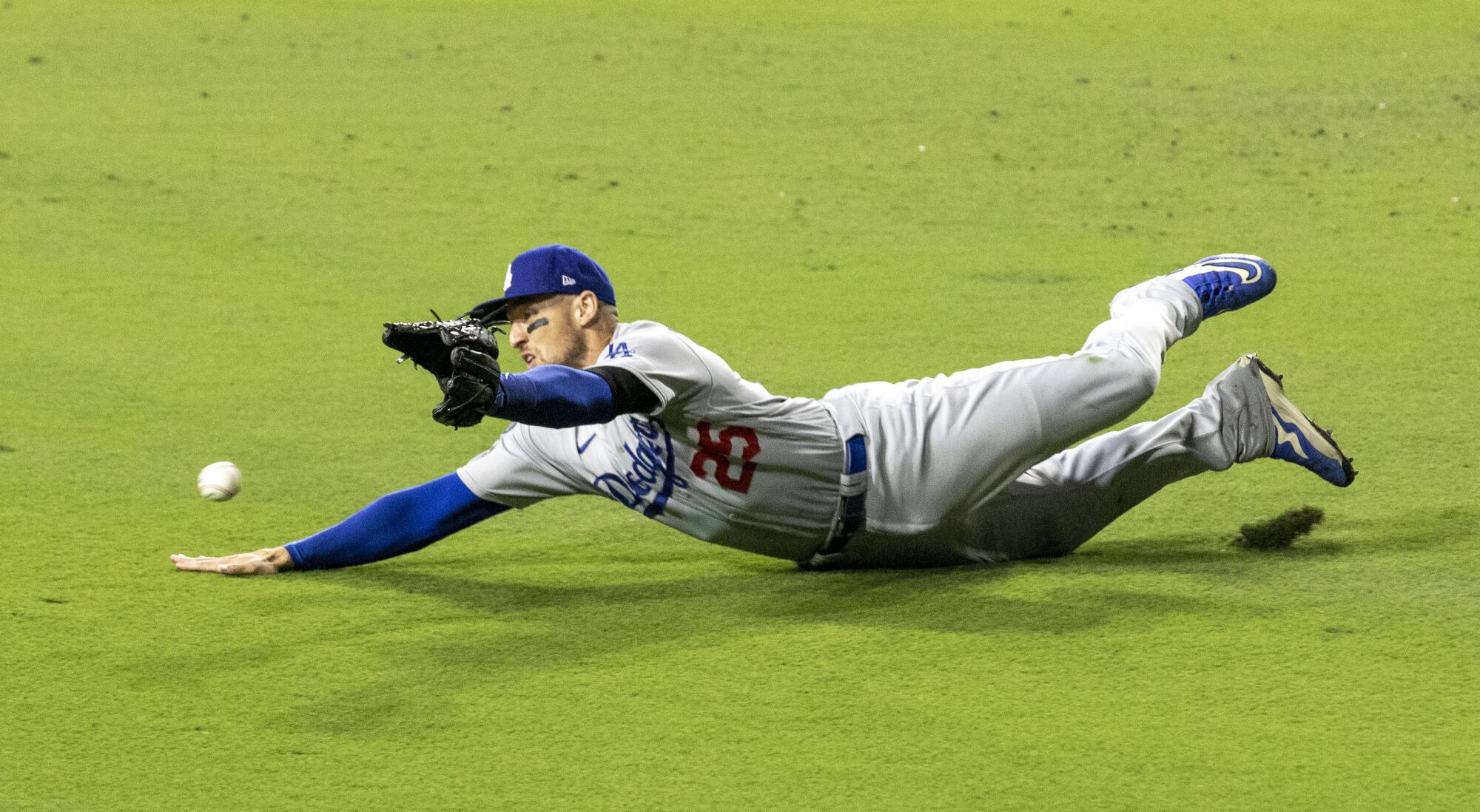 Dodgers center fielder Trayce Thompson dives for a liner.