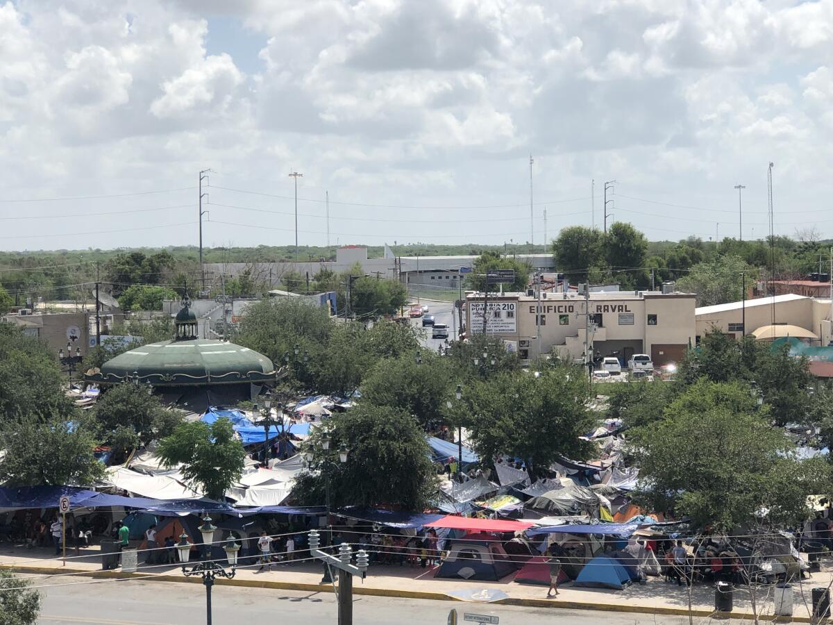 Tents and tarps crowd the Plaza Las Americas migrant camp in Reynosa, Mexico.