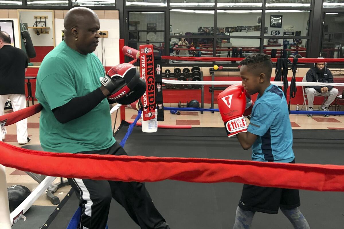 Buster Douglas shares life lessons, skills with young boxers
