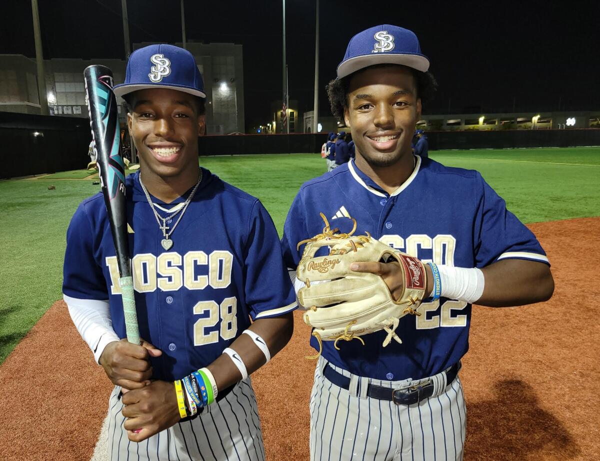 The Clark twins, Miles (left) and James of St. John Bosco High pose for a photo.