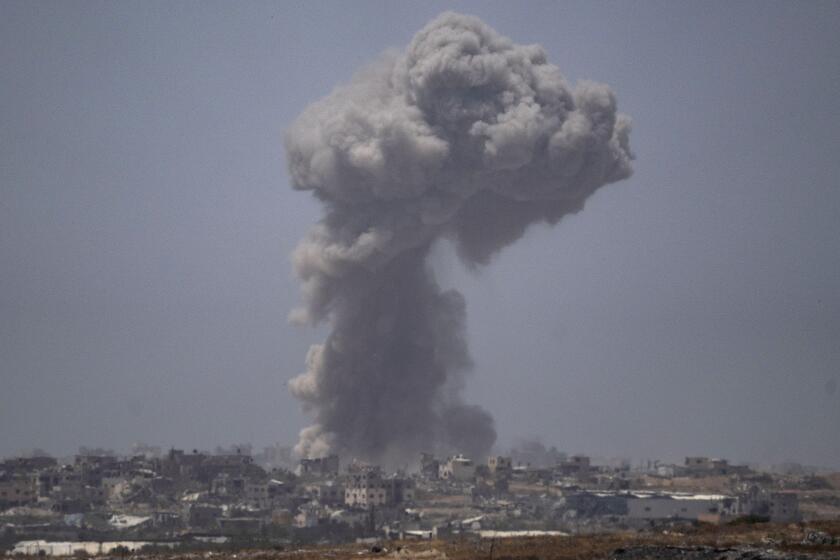 Smoke billows after an explosion in the Gaza Strip, as seen from southern Israel Tuesday, May 21, 2024. (AP Photo/Leo Correa)