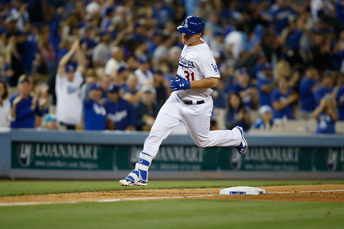 Joc Pederson rounds third base after hitting a solo home run in the seventh inning Saturday against Arizona.