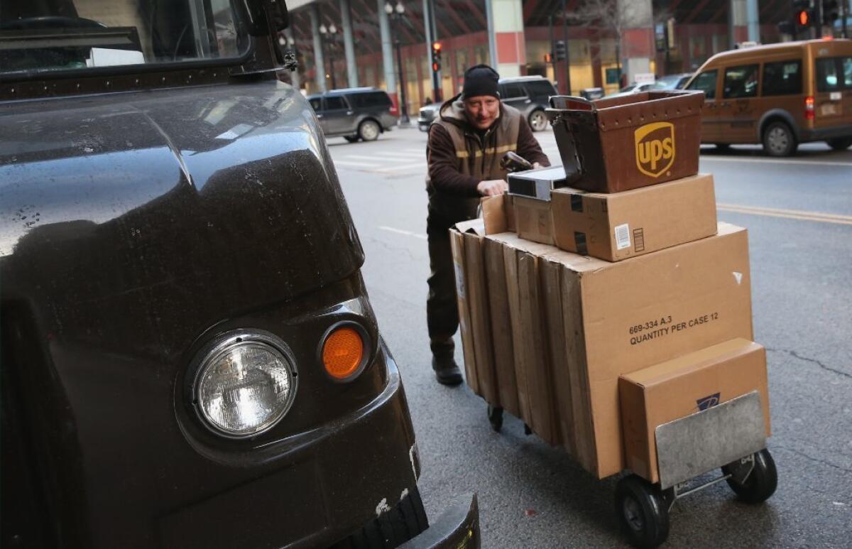We expected you on Dec. 24, pal: UPS driver making deliveries in Chicago on the day after Christmas.