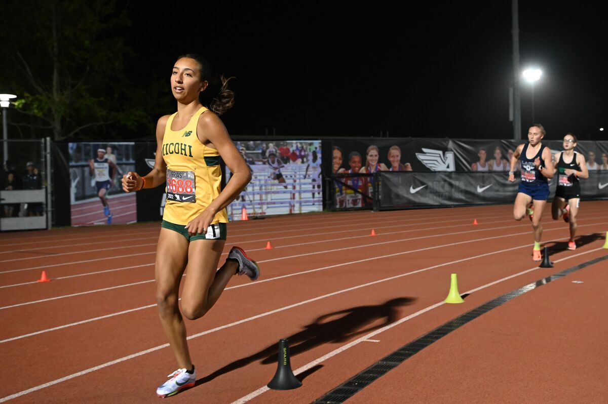 Dalia Frias of Mira Costa leads the girls' 3200 meter run at the Arcadia track and field invitational. (