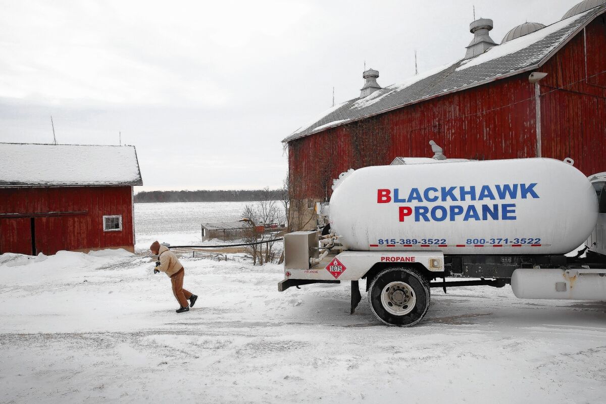 Mark Burger delivers propane to a farm near Clinton, Wis., on Friday. With propane supplies low, prices have shot up.