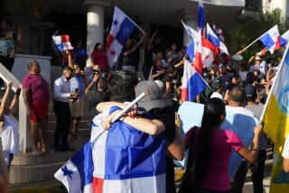 Protesters celebrate as they learn that Panama's Supreme Court has declared unconstitutional a 20-year concession for a Canadian copper mine that had sparked weeks of protests, in Panama City, Tuesday, Nov. 28, 2023. (AP Photo/Arnulfo Franco)
