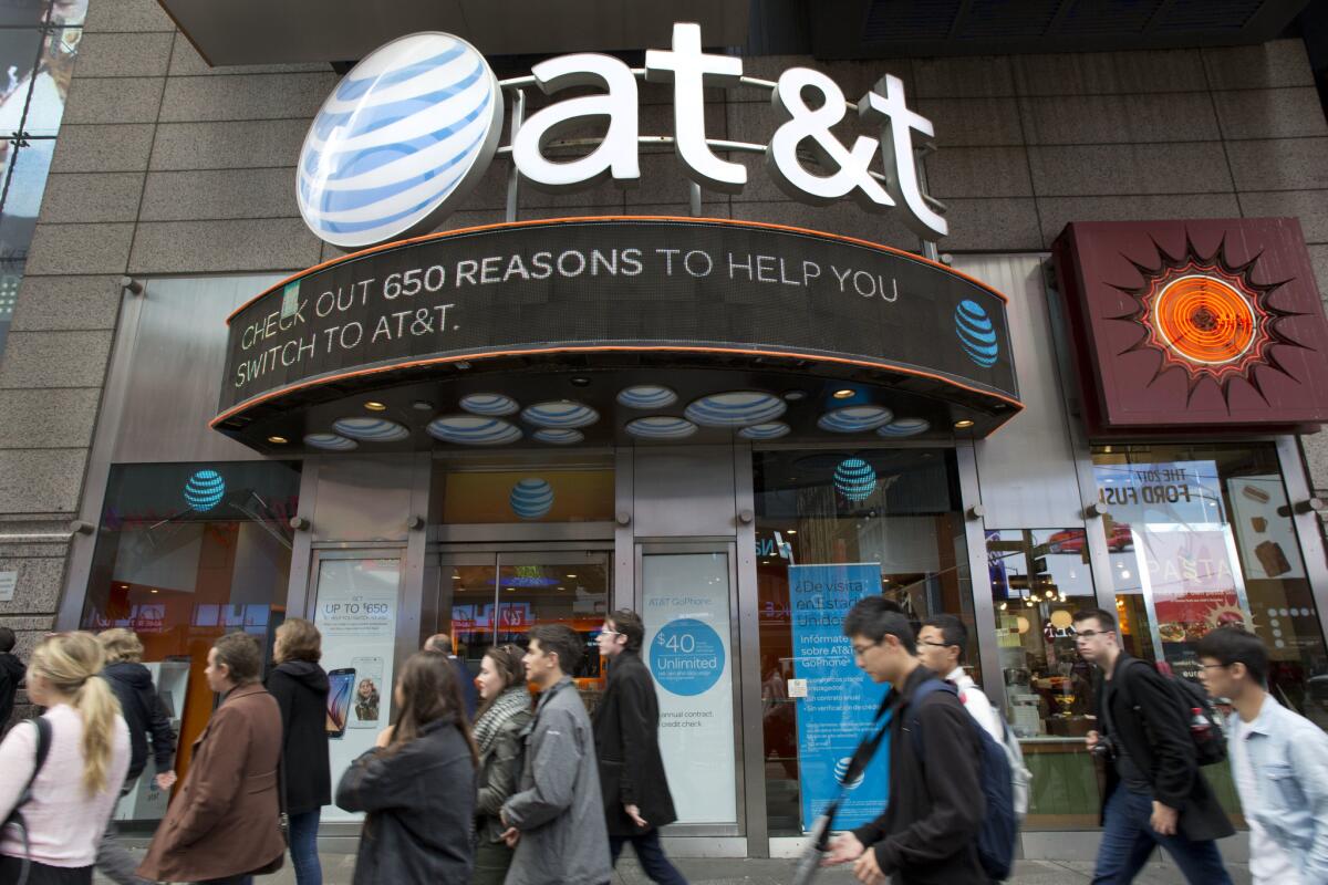 AT&T Chief Executive Randall Stephenson expressed optimism Monday that regulators would give their blessing to the merger by the end of next year. Above, an AT&T retail store in New York.