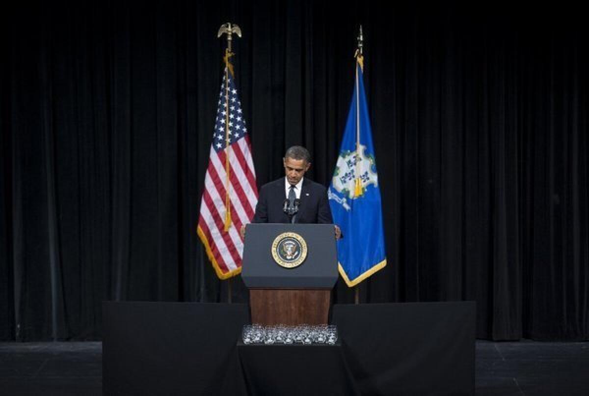 President Obama pauses as he delivers a speech at an interfaith vigil in Newtown, Conn., on Sunday.