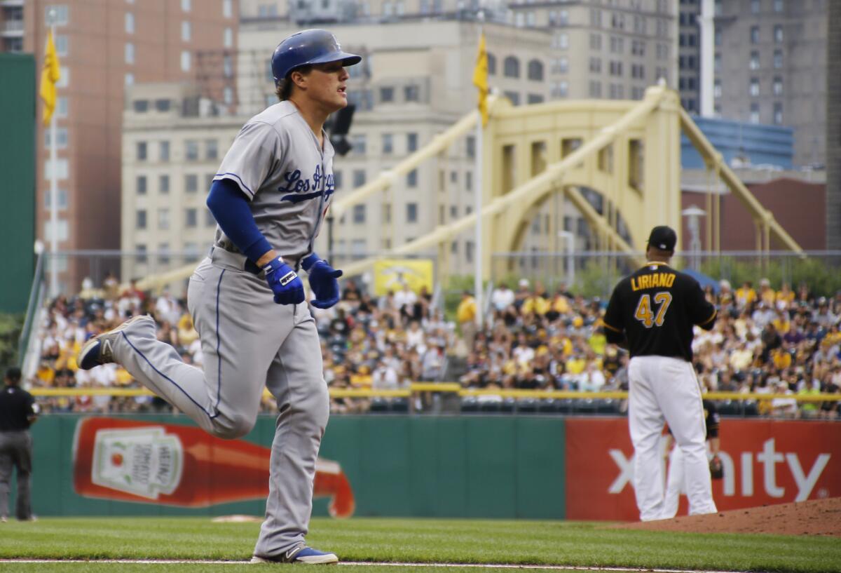 Dodgers' Enrique Hernandez rounds the bases after hitting a two-run home run off Pittsburgh pitcher Francisco Liriano on Saturday.