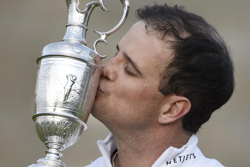 Zach Johnson kisses the famed Claret Jug after winning the British Open at St. Andrews, Scotland, on Monday.