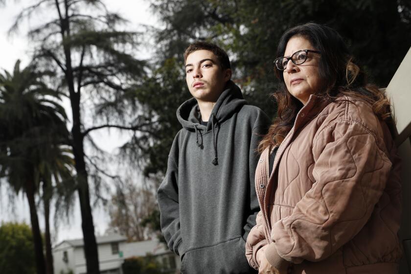 LaVerne, CA, Wednesday, March 1, 2023 - Ricky Camora with his guardian Stephanie Camora. Ricky was forced out of Bonita High School just four days into this school year, after being caught vaping on campus. He was transferred to Options for Youth, a charter school where he only goes twice a week. He's falling behind academically and his aunt and guardian, Stephanie, is worried he won't graduate. Robert Gauthier/Los Angeles Times)
