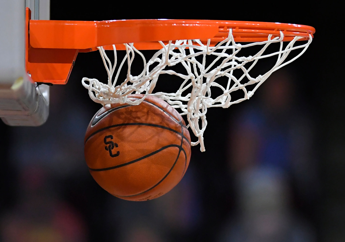 A basketball falls through the net