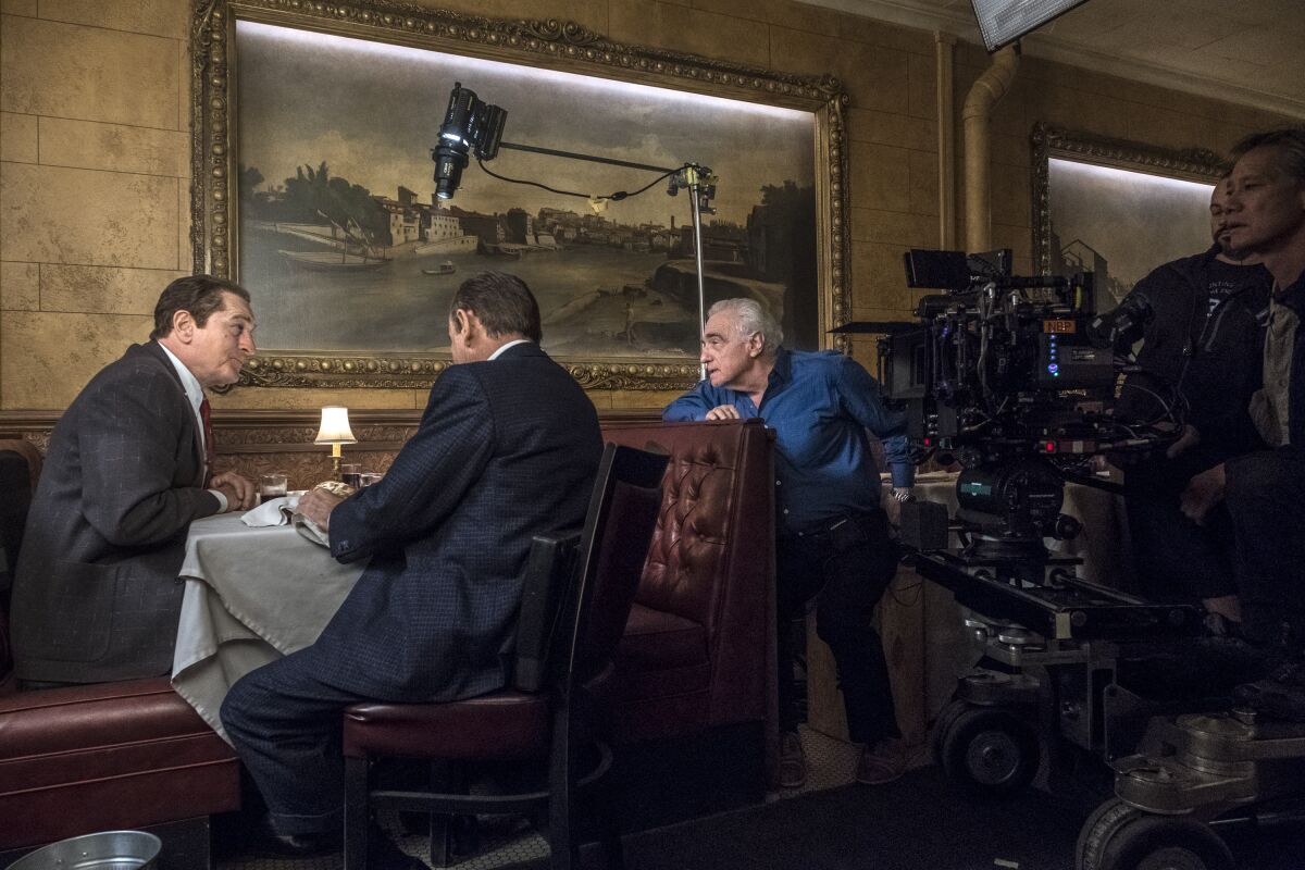 Martin Scorsese directs Robert De Niro, left, and Joe Pesci on the set of "The Irishman."
