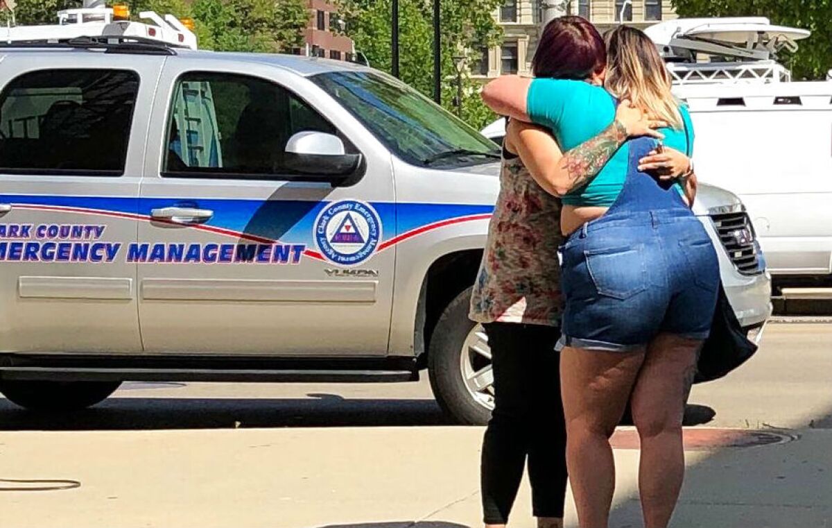 In Dayton, Ohio, residents comfort each other as they await word on whether they know any of the victims of a mass shooting.