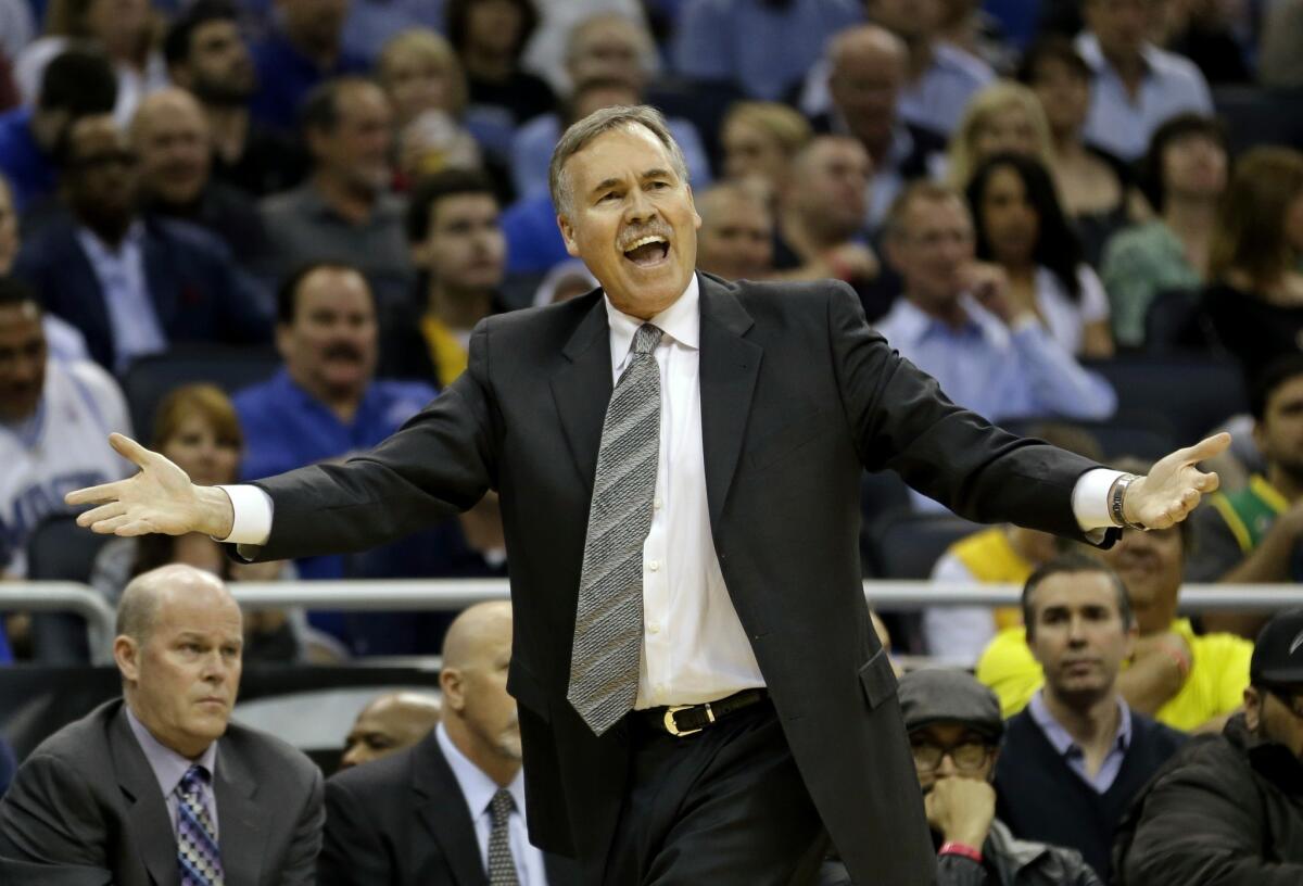 Lakers Coach Mike D'Antoni questions a call by an official.