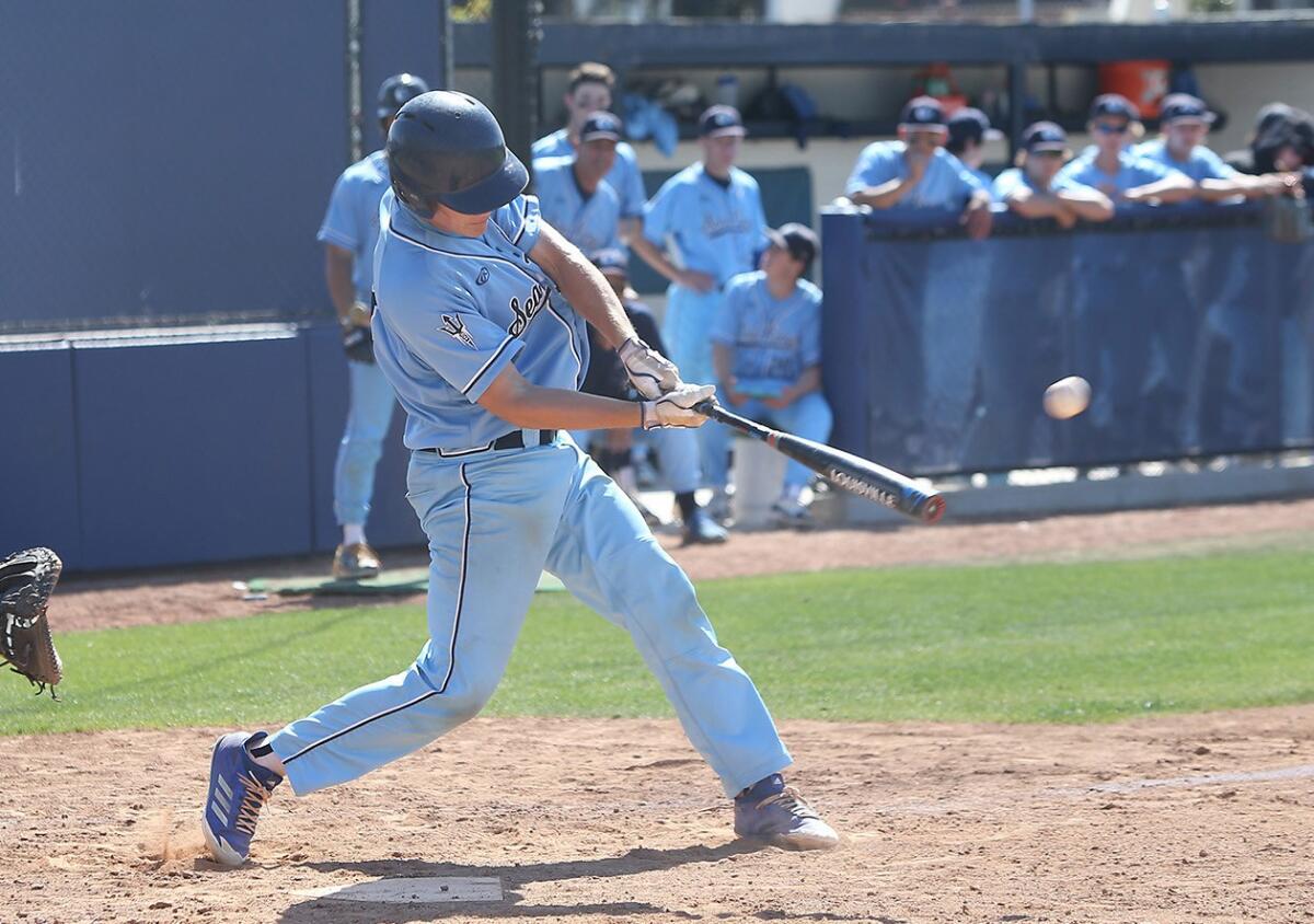 Corona del Mar High's Nick Rottler rips a two-run homer during a Newport Rib Co. Tournament game against Laguna Hills on April 17, 2018.