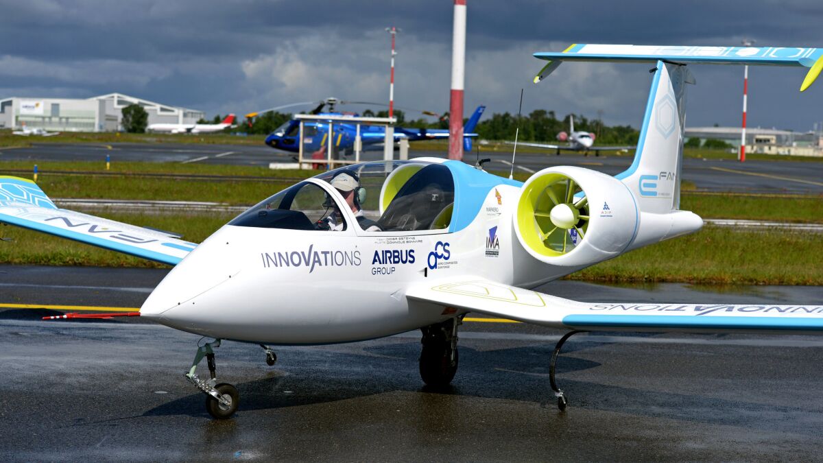 A pilot sits inside the Airbus E-Fan prototype electric aircraft during a presentation at Bordeaux-Merignac Airport in France on April 25, 2014.