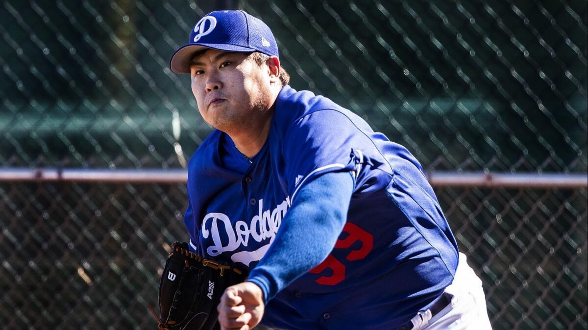 Dodgers pitcher Hyun-Jin Ryu warms-up during spring training at Camelback Ranch on February 19, 2019.