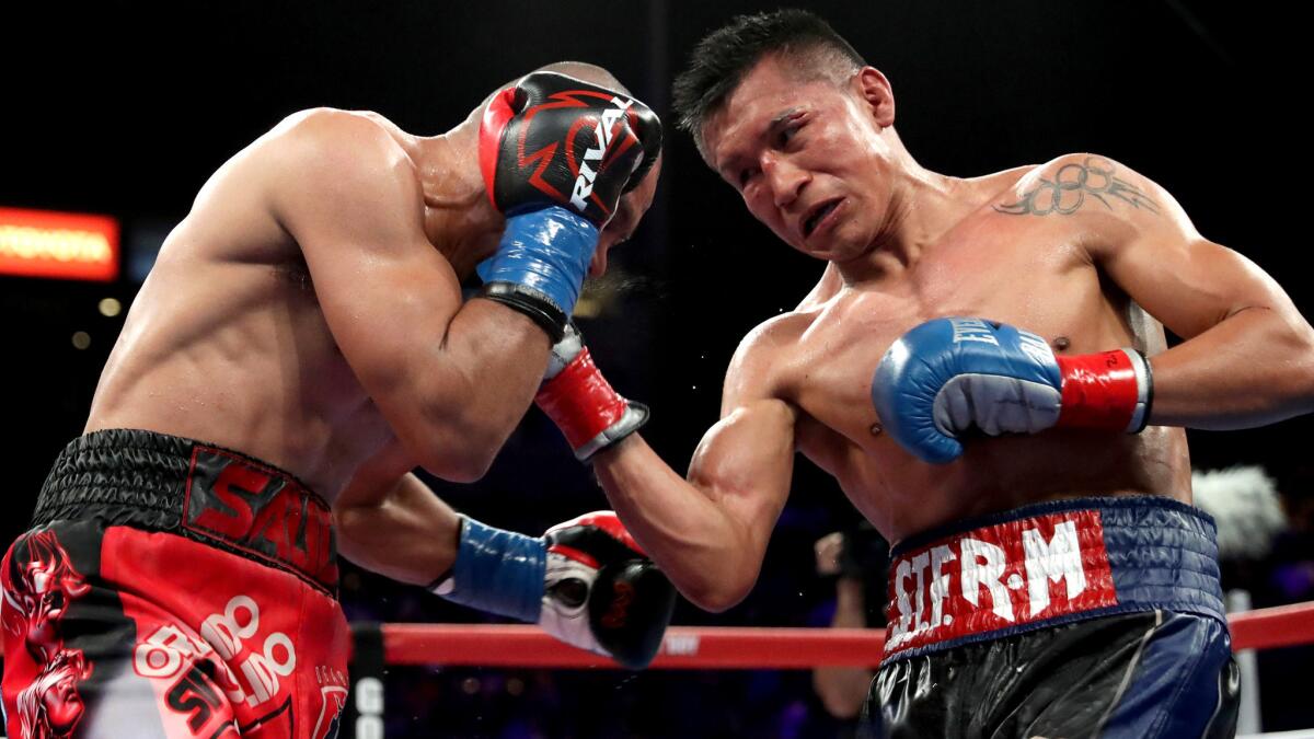 Francisco Vargas, right, lands an uppercut to the head of Orlando Salido during their WBC super-featherweight championship fight at StubHub Center on June 4.