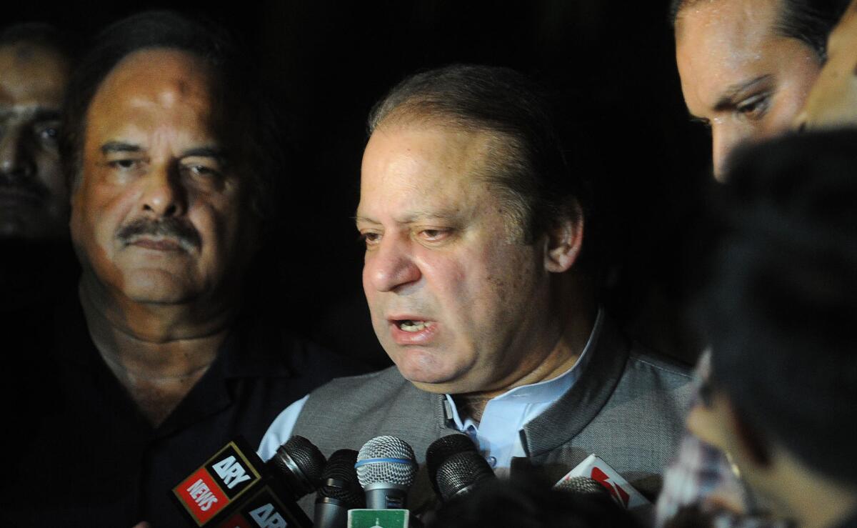 Pakistan's newly elected Prime Minister Nawaz Sharif speaks to the media as he leaves the hospital where Pakistani politician Imran Khan was admitted after being injured, in Lahore.