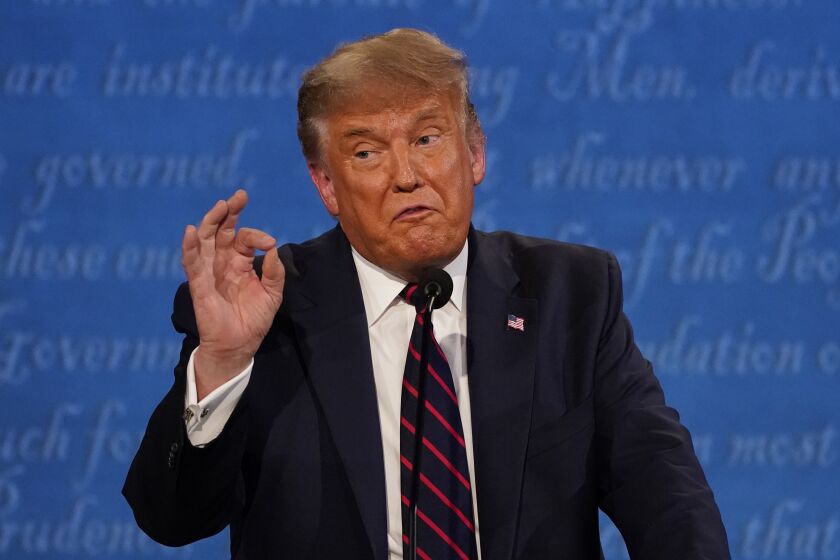 President Donald Trump gestures while speaking during the first presidential debate Tuesday, Sept. 29, 2020, at Case Western University and Cleveland Clinic, in Cleveland, Ohio. (AP Photo/Julio Cortez)