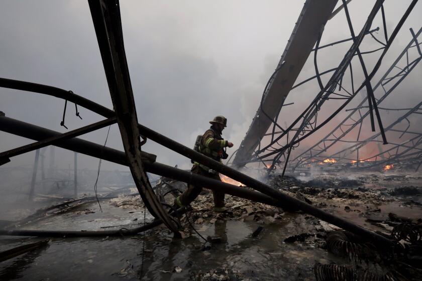 REDLANDS CA JUNE 5, 2020 - Firefighters battle a 3-alarm fire at a large warehouse near the 10 Freeway in Redlands Friday, June 5, 2020. Irfan Khan / Los Angeles Times)