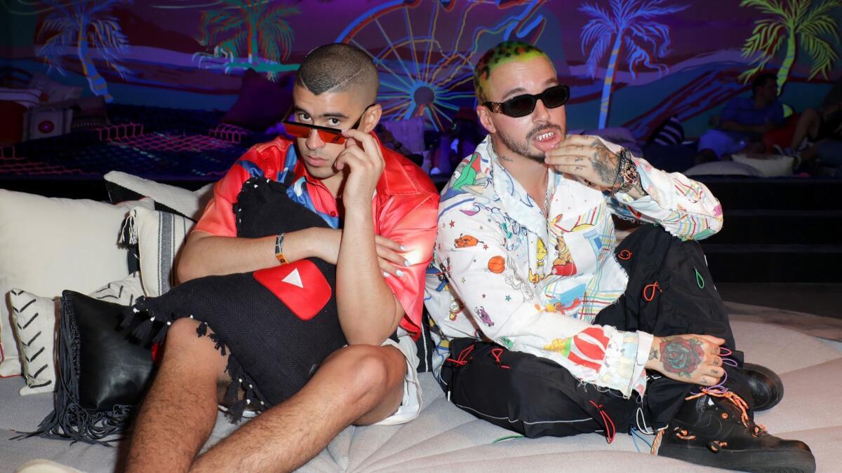 Bad Bunny and J Balvin relax in an artists' lounge at the 2019 Coachella festival.