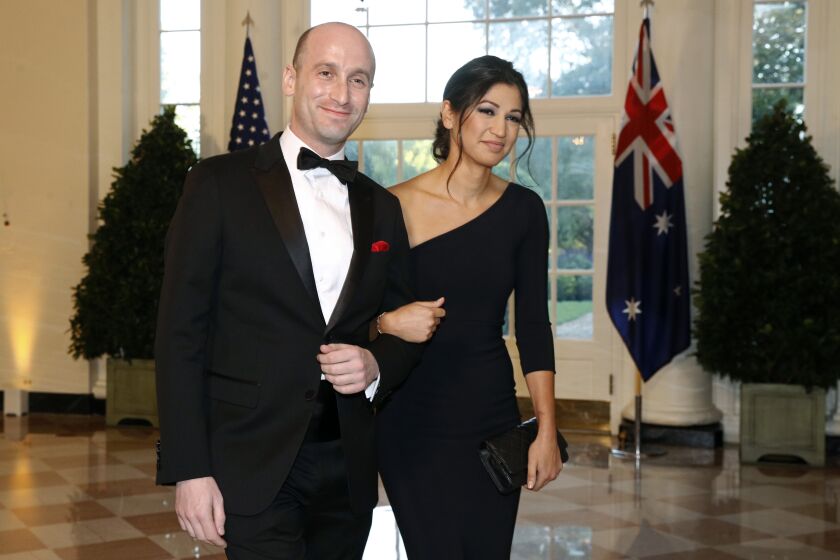 FILE - In this Sept. 20, 2019, file photo President Donald Trump's White House Senior Adviser Stephen Miller, left, and Katie Waldman, now Miller, arrive for a State Dinner with Australian Prime Minister Scott Morrison and President Donald Trump at the White House in Washington. Vice President Mike Pence's press secretary has the coronavirus, the White House said Friday, making her the second person who works at the White House complex known to test positive for the virus this week. Pence spokeswoman Katie Miller, who tested positive Friday, May 8, 2020, had been in recent contact with Pence but not with the president. (AP Photo/Patrick Semansky, File)