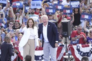 Democratic presidential nominee Vice President Kamala Harris is welcomed by Democratic vice presidential nominee Minnesota Gov. Tim Walz, before she delivers remarks at a campaign event, Wednesday, Aug. 7, 2024, in Eau Claire, Wisc. (AP Photo/Charles Rex Arbogast)