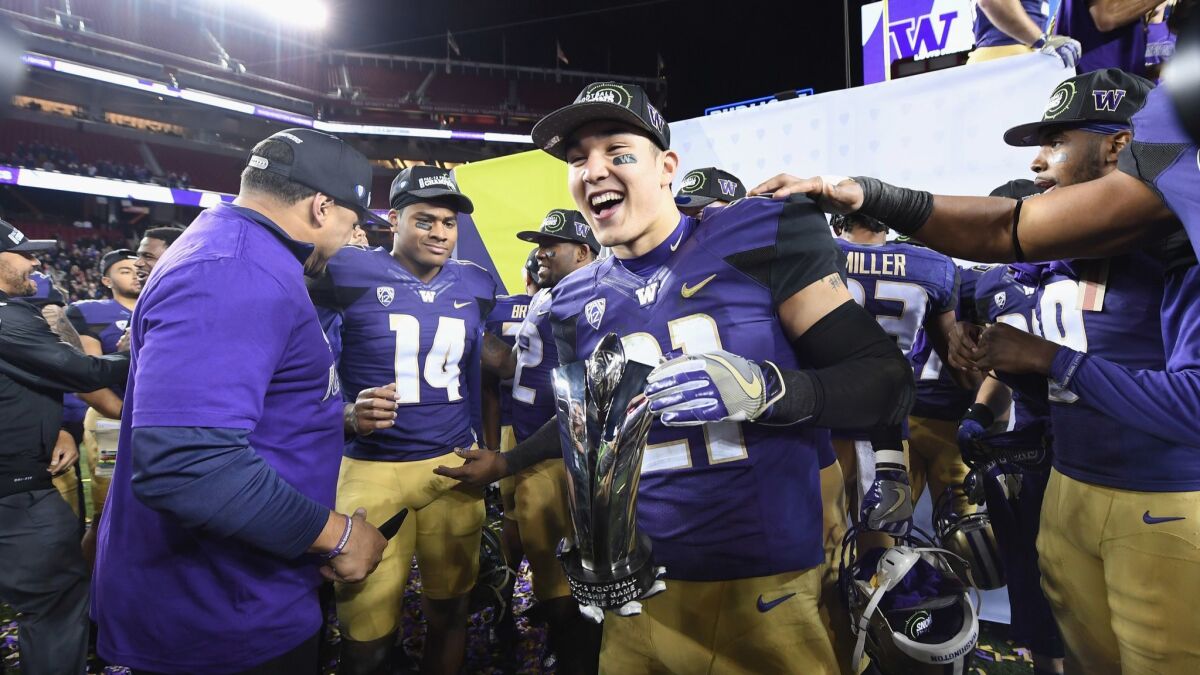 Taylor Rapp (21) of the Washington Huskies celebrates after beating the Colorado Buffaloes in the Pac-12 championship game at Levi's Stadium on December 2, 2016 in Santa Clara.