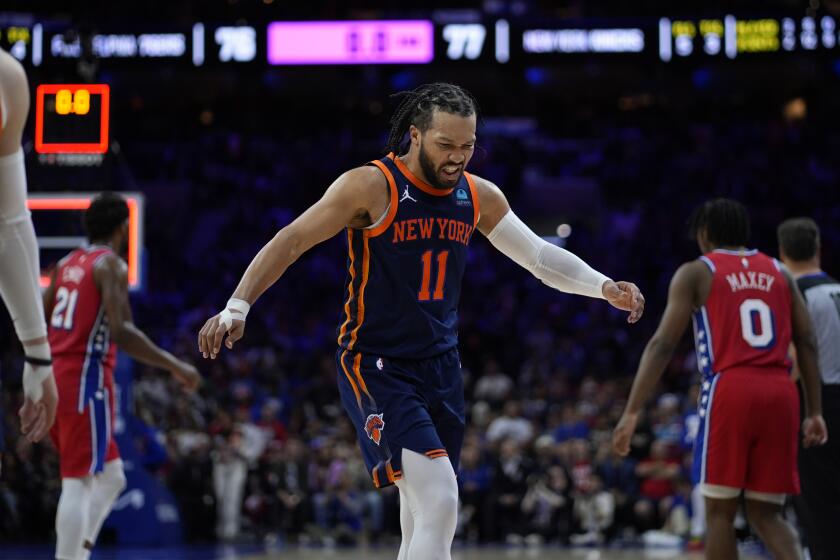 New York Knicks' Jalen Brunson grimaces as he walks off the court after the third quarter of Game 4 in an NBA basketball first-round playoff series against the Philadelphia 76ers, Sunday, April 28, 2024, in Philadelphia. (AP Photo/Matt Slocum)