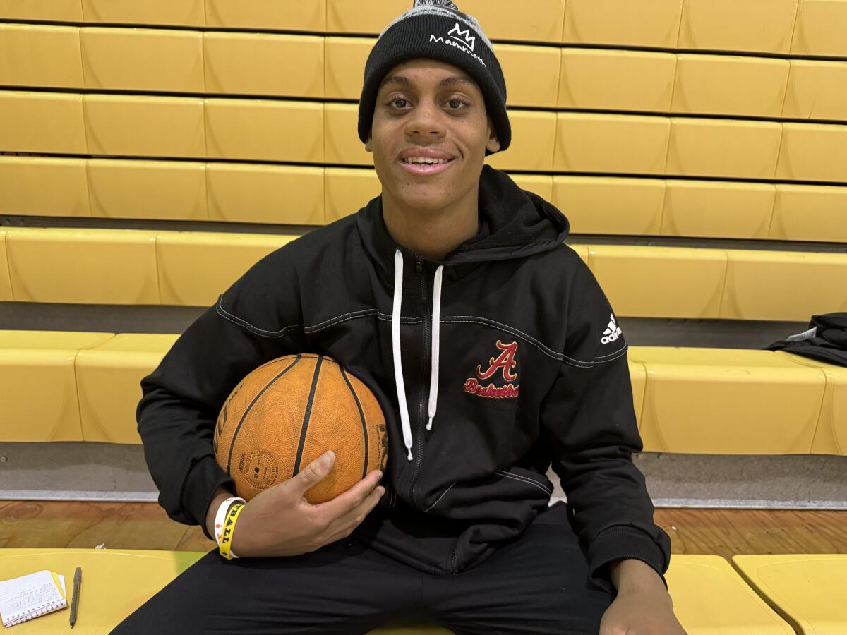 Two-sport standout Mike Lindsay of Bishop Alemany poses for a photo in the school's gymnasium.