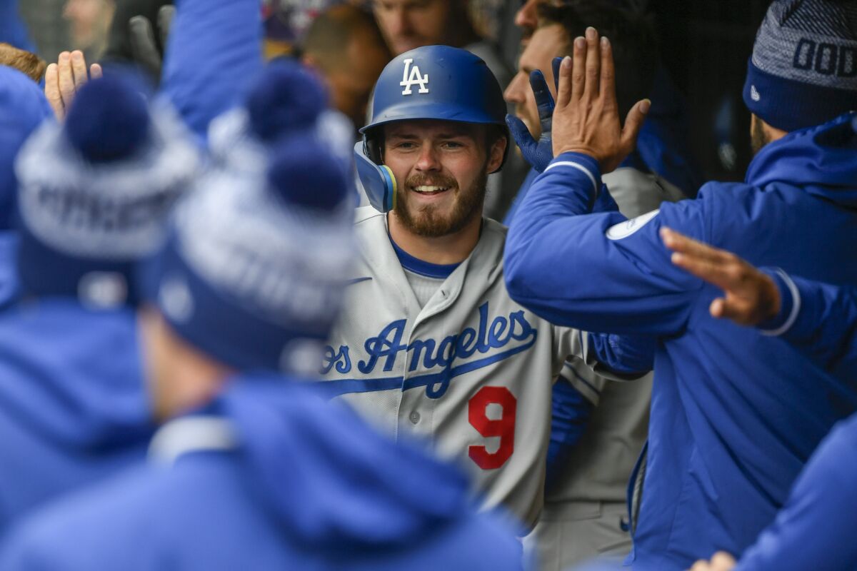 Dodgers second baseman Gavin Lux celebrates with teammates after hitting a home run against the Minnesota Twins on April 13.