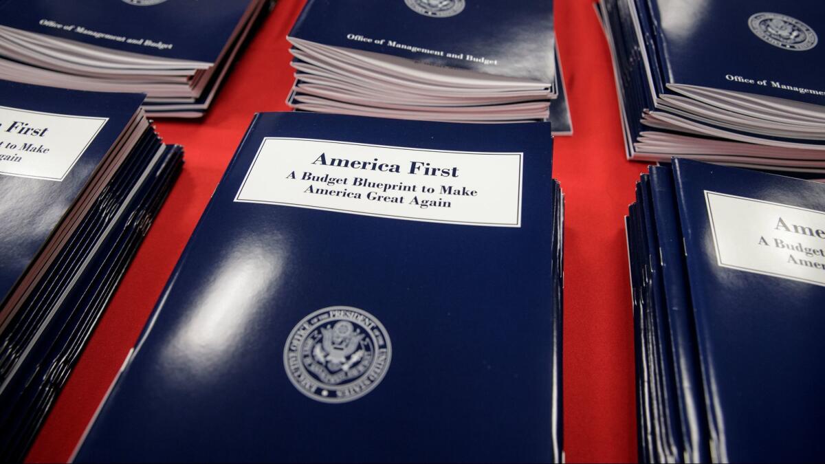 Copies of President Trump's first budget are displayed at the Government Printing Office on March 16 in Washington.
