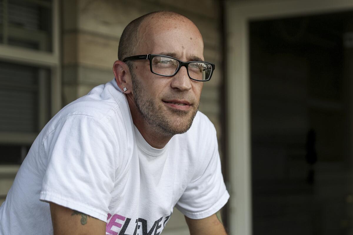 FILE - In this Aug. 13, 2018, file photo, Tyson Timbs poses for a portrait at his aunt's home in Marion, Ind. Times an Indiana man whose Land Rover worth $35,000 was seized after his conviction for selling $400 worth of heroin will get to keep the vehicle under a state Supreme Court ruling. The court's 4-1 decision Thursday, June 10, 2021, in favor of Timbs of Marion comes after a legal fight that began in 2013 and resulted in the U.S. Supreme Court's ruling that the Constitution's ban on excessive fines applies to states. (Jenna Watson/The Indianapolis Star via AP, File)