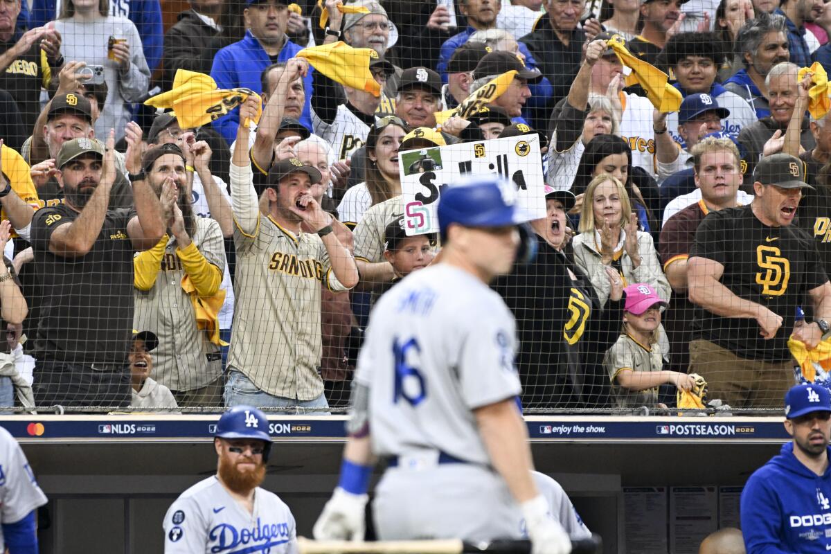 San Diego Padres fans cheer after Dodgers designated hitter Will Smith strikes out during the first inning Friday.