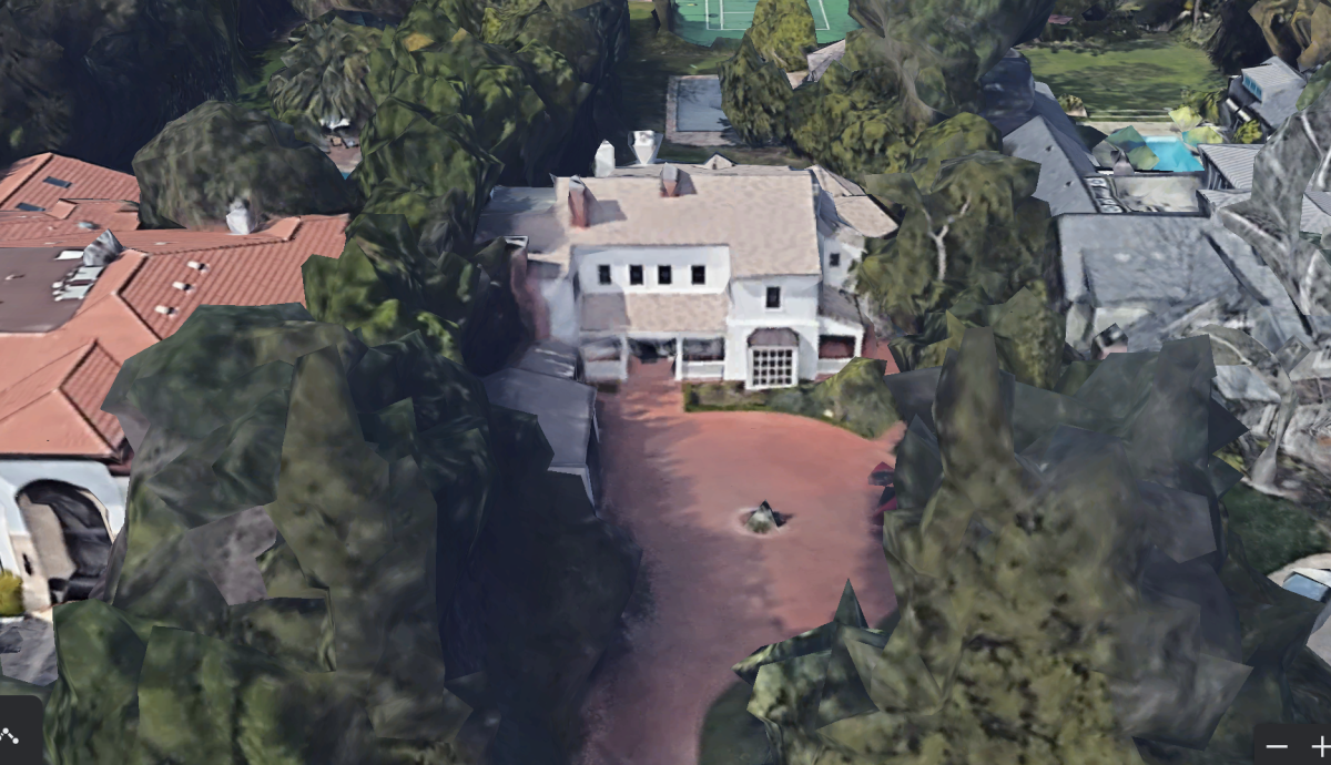 An aerial view of a Colonial-style home.