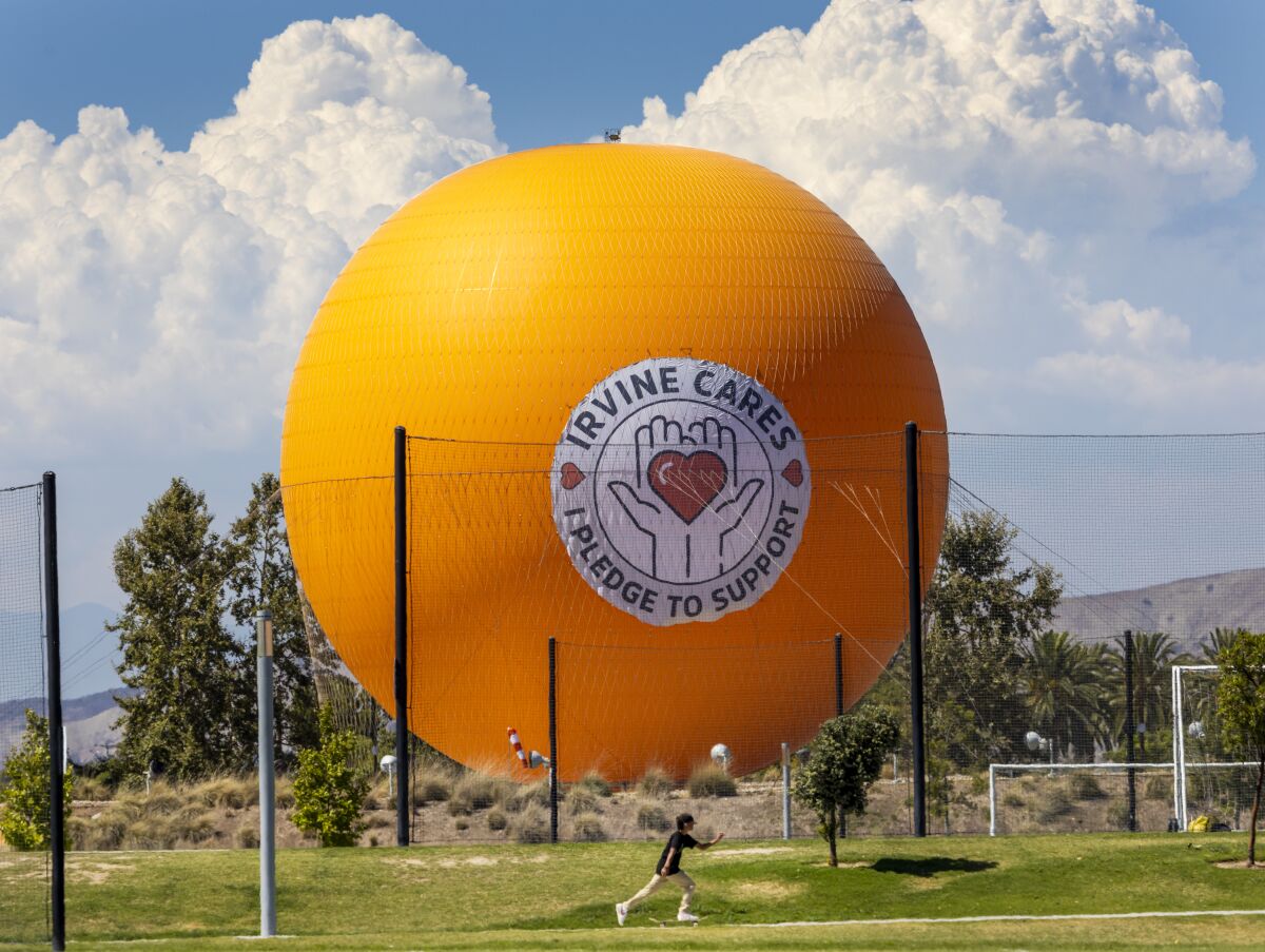 A big orange balloon at the Great Park in Irvine.