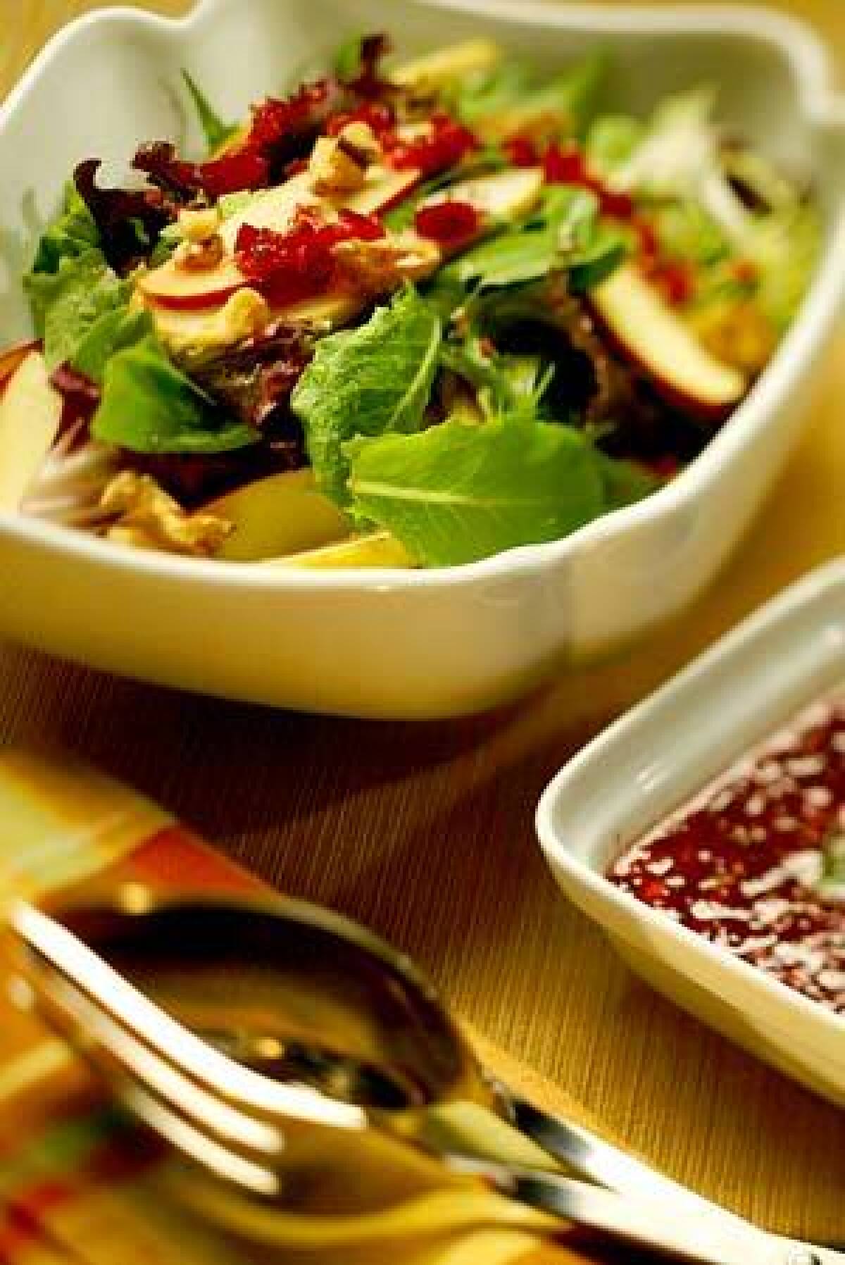 This salad is made with apple, pear, dried cranberries and toasted walnuts. Recipe: Pear and apple salad with cranberry vinaigrette
