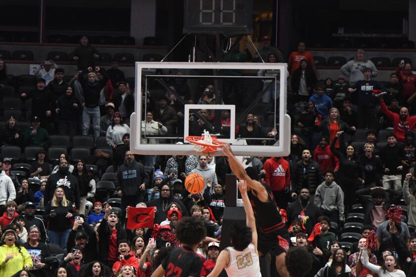 Aaron McBride dunks before time expires 