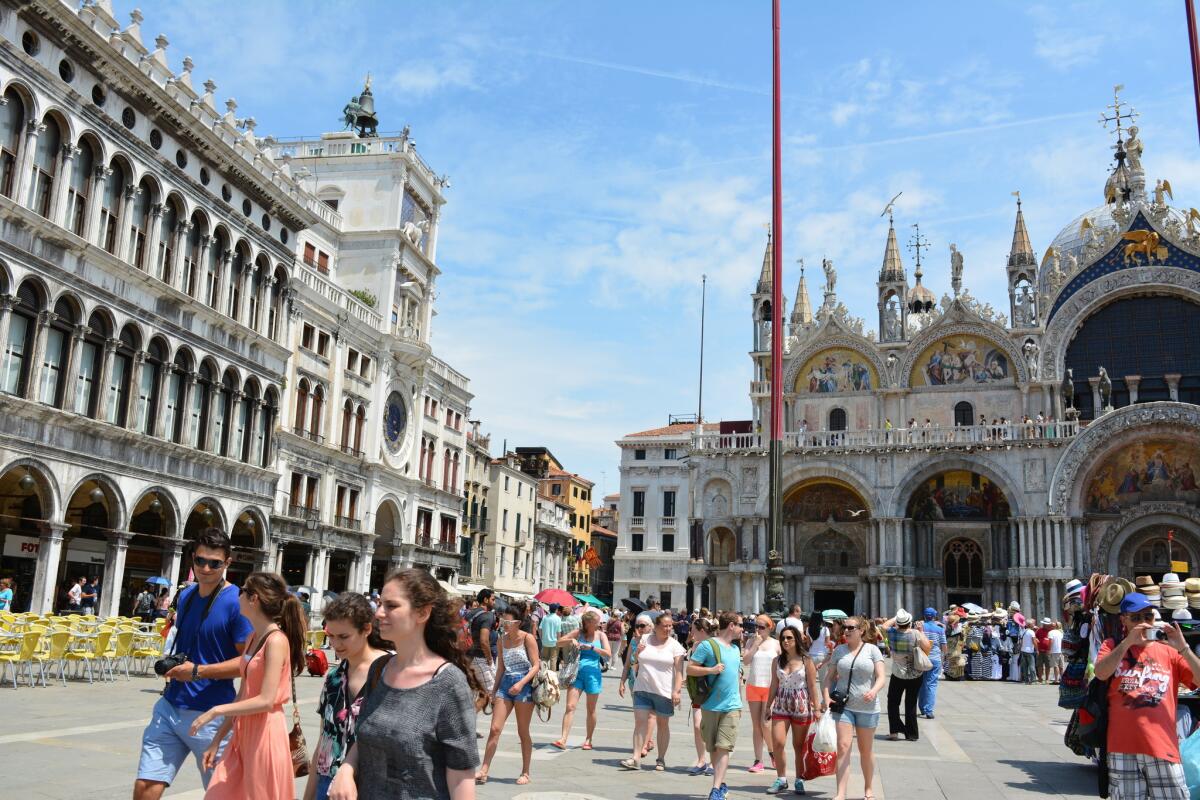 Tourists fill St. Mark’s Square in Venice before the ban on visitors.