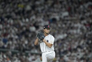 Yu Darvish of Japan throws during the eighth inning of the quarterfinal game between Italy and Japan at the World Baseball Classic (WBC) at Tokyo Dome in Tokyo, Japan, Thursday, March 16, 2023. (AP Photo/Eugene Hoshiko)