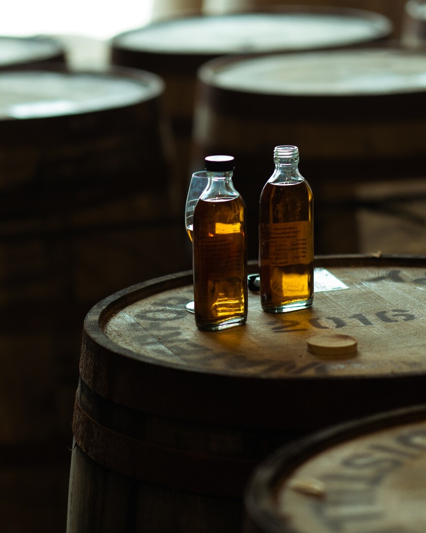 Irish whiskey bottles on caskets at Waterford Distillery