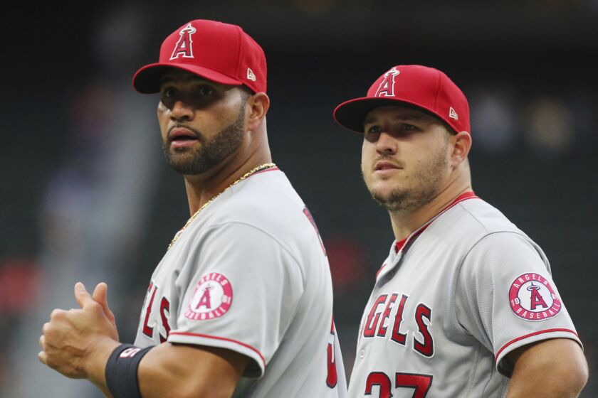Los Angeles Angels first baseman Albert Pujols (5) and center fielder Mike Trout (27).